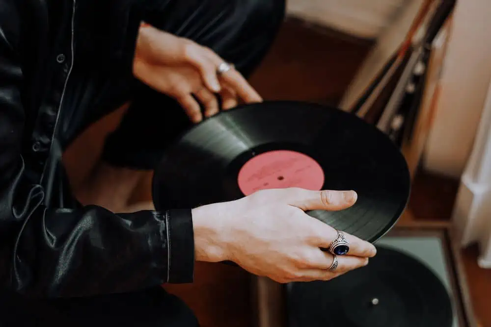 holding a warped vinyl record